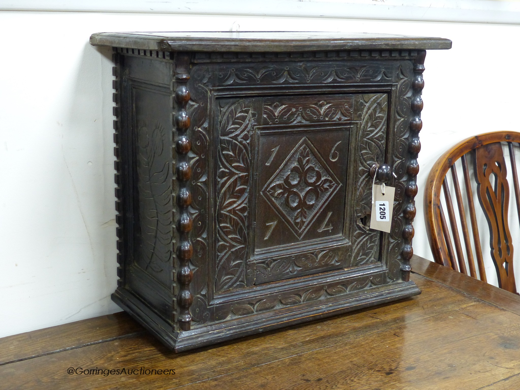 A Charles II carved oak wall cupboard (possibly Dorset)